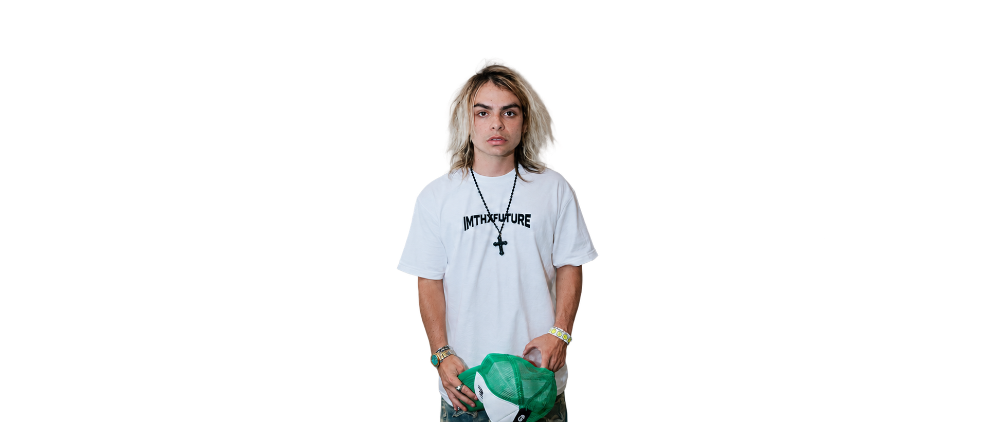 IMTHXFUTURE wearing the white logo T-shirt and holding a green trucker cap